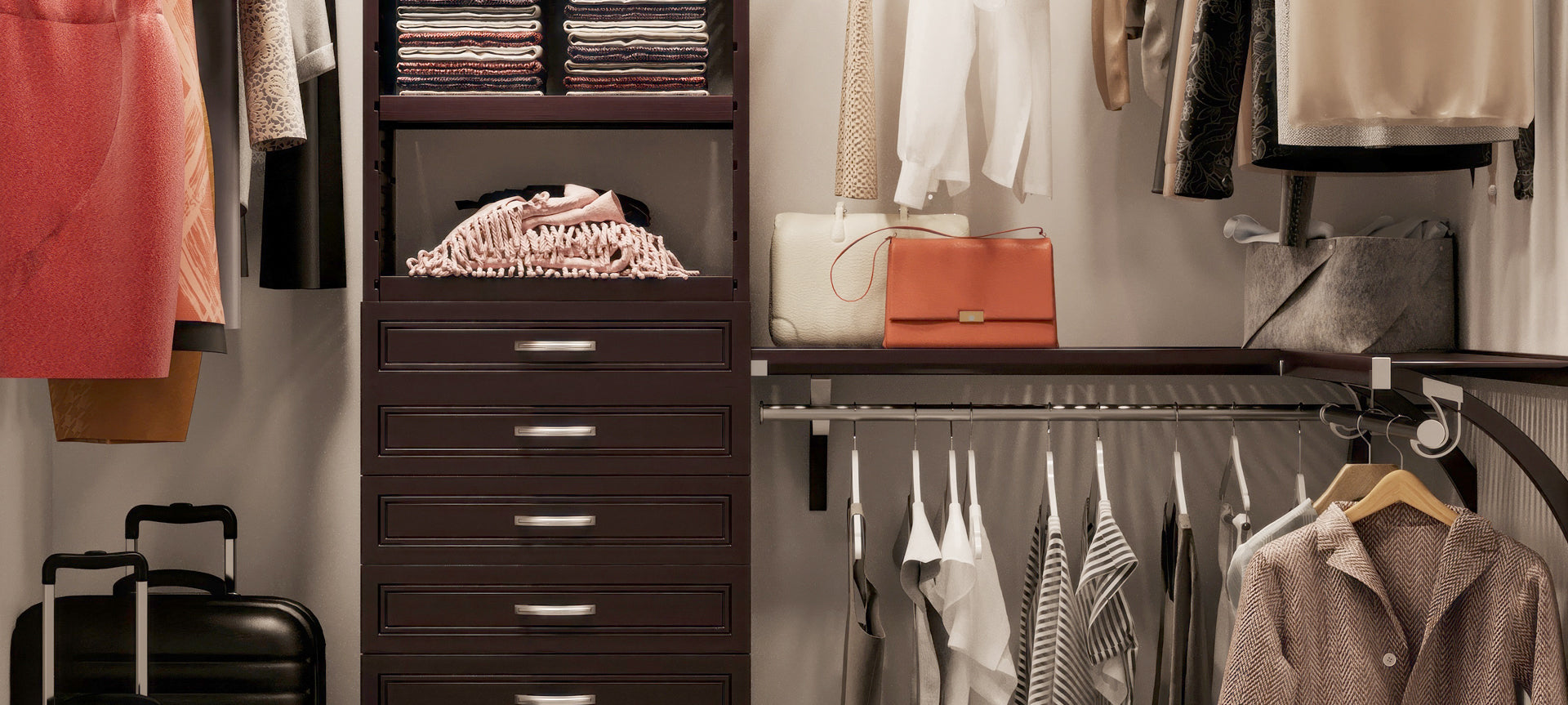 closeup of organized closet with espresso closet system and drawers